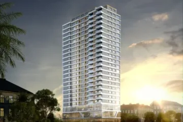 Exterior view of Luckinn Ivy Residence high-rise apartment tower in Parklands Nairobi at sunset.