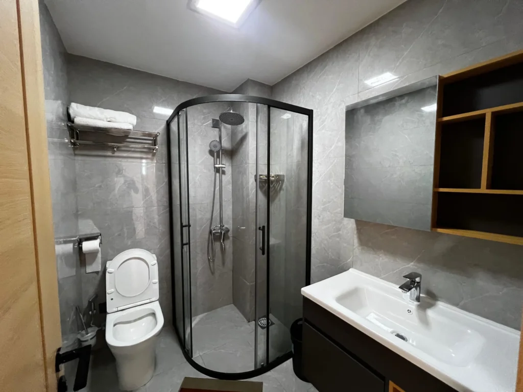 Ensuite bathroom with corner shower at Riara One Residency Kilimani apartment